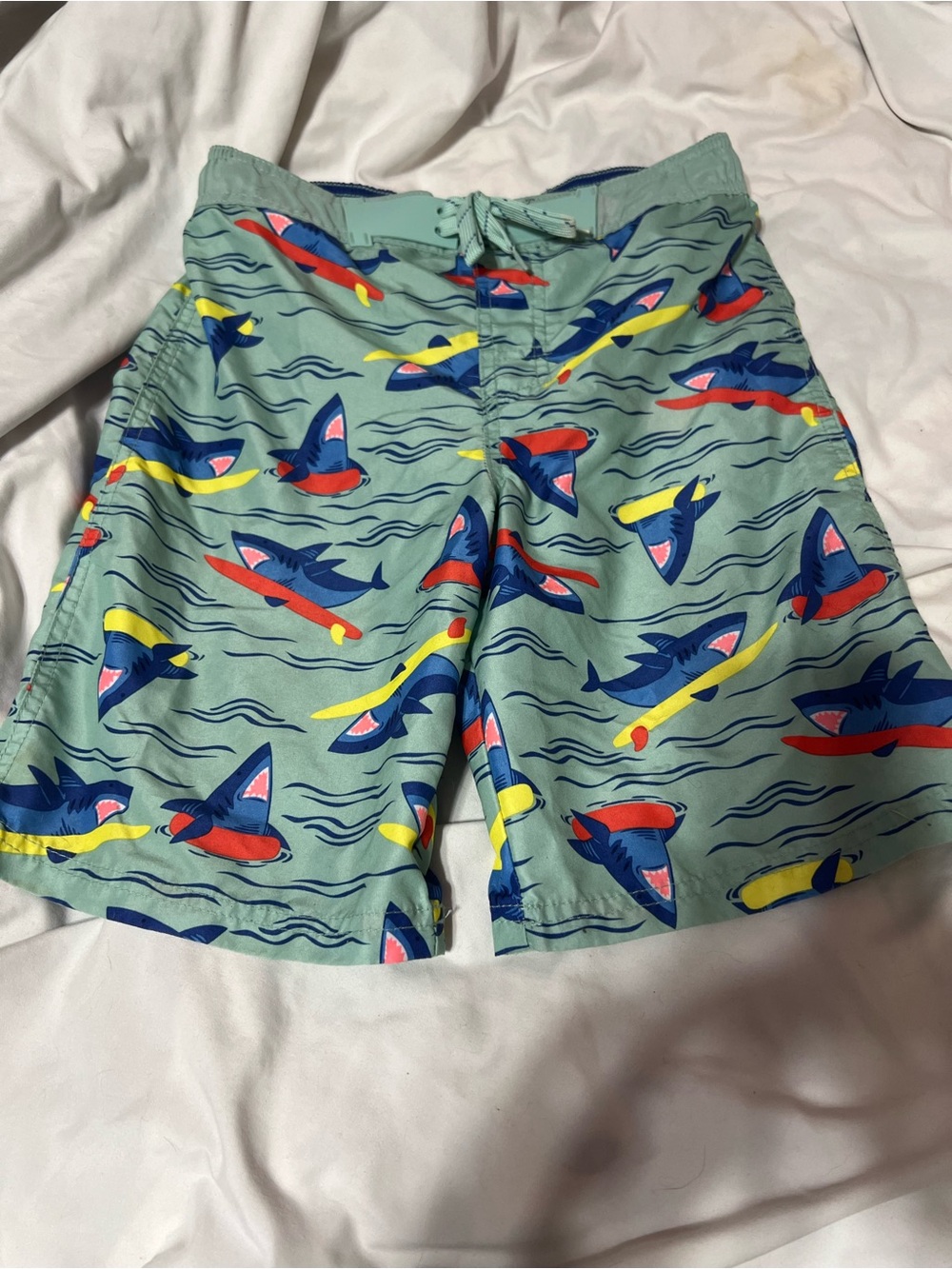 Cat & Jack Sage Green Shark Surf Swim Shorts with Blue, Red & Yellow